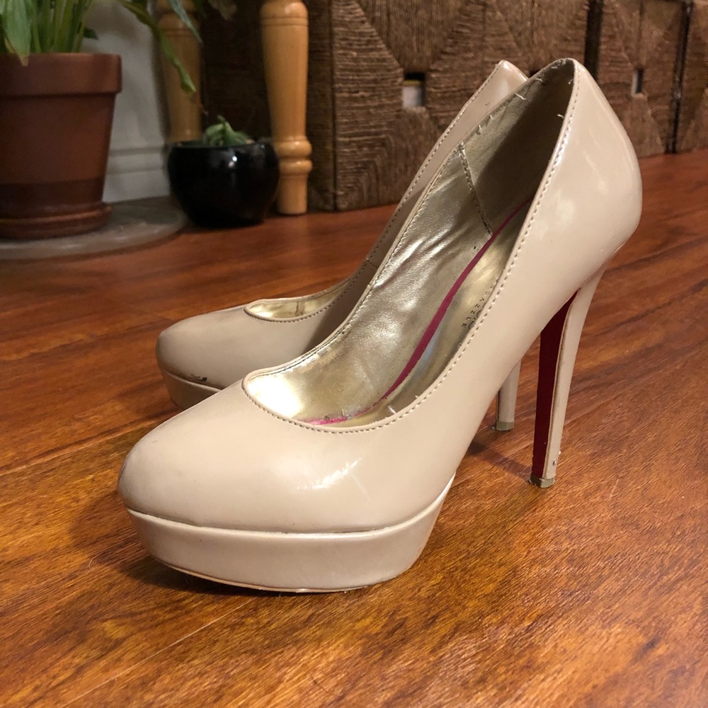 Nude heels with red bottoms